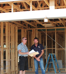 Two men on building site.