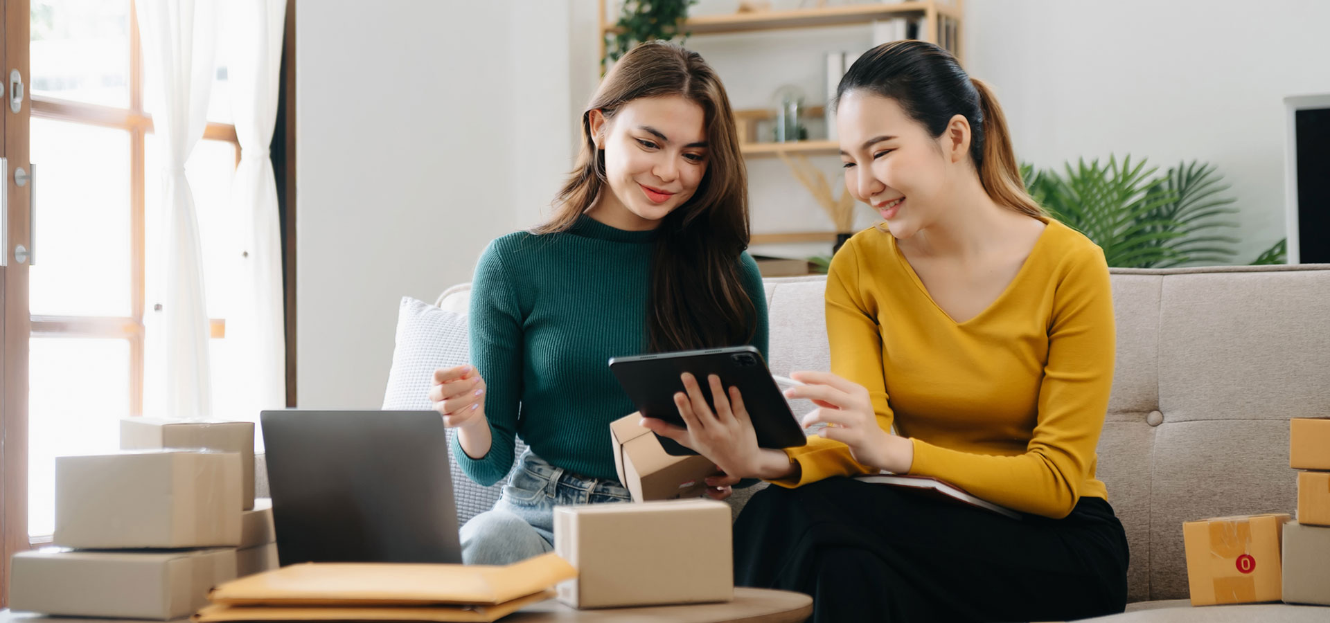 Two female small business owners discussing ideas.